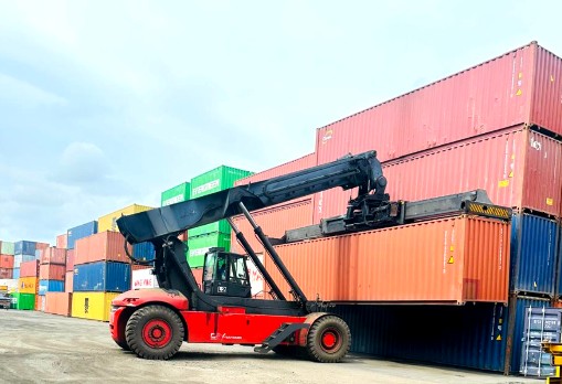 Reach stacker moving a container